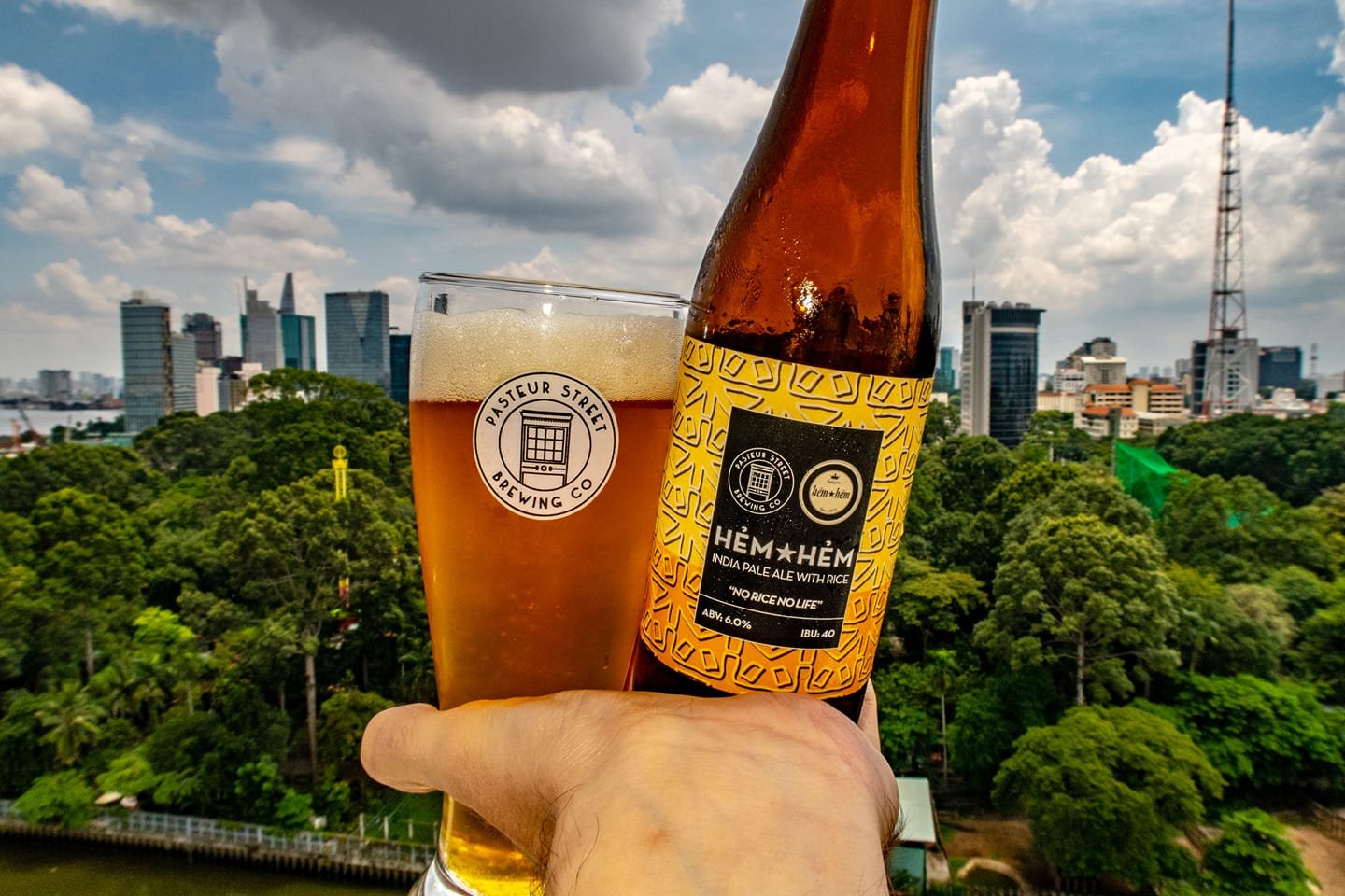 A photo of a Hemhem Pasteur Street no rice no life IPA overlooking the zoo in Ho chi minh city